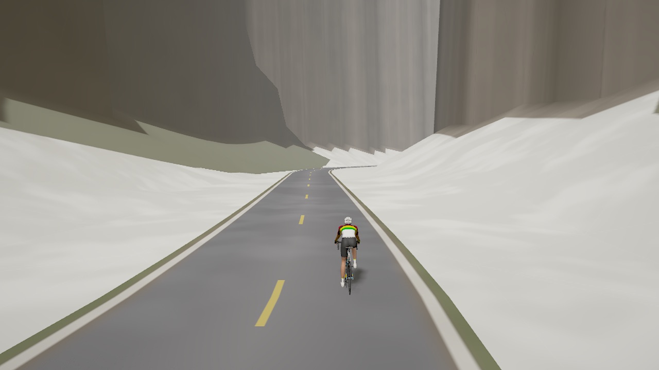 Pikes Peak: a road between grey slab walls with white snow patches